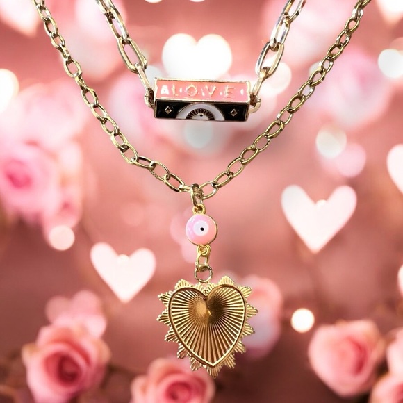 Gold toned chains with black, white, gold, and pastel pink enamel charms. - Picture 5 of 17